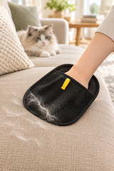 MAVORNE FurLift glove collecting cat hair from a fabric sofa